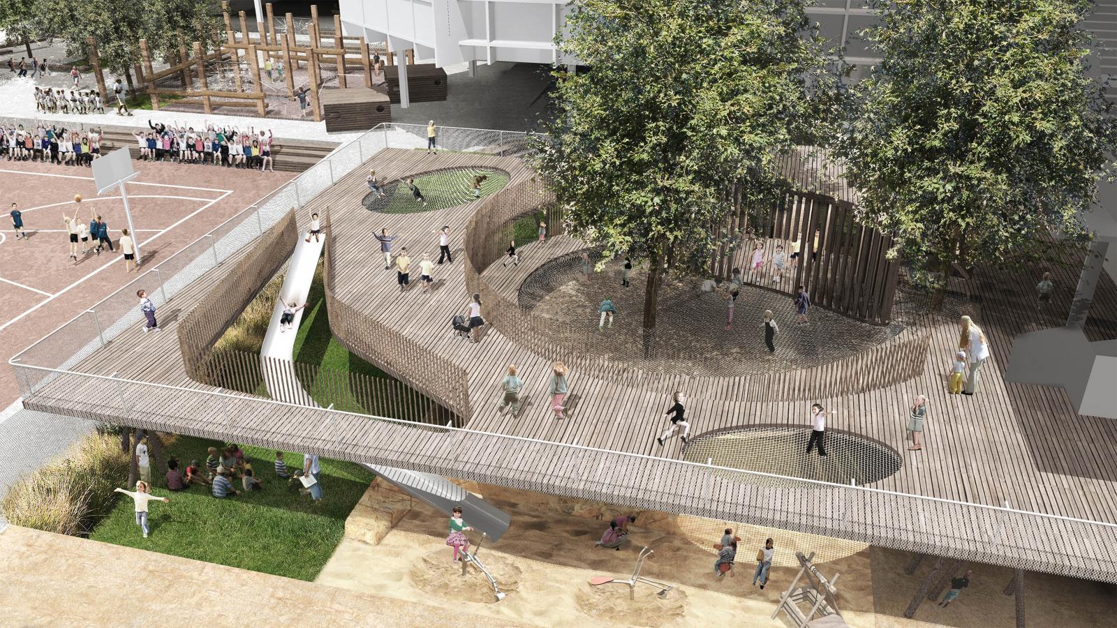 A modern playground at Arthur Phillip School in Parramatta boasts multiple levels, featuring slides, climbing structures, and swings under tree shade. Children and adults interact throughout the space, with some walking on elevated wooden paths and others playing on the surrounding grass and sand areas.