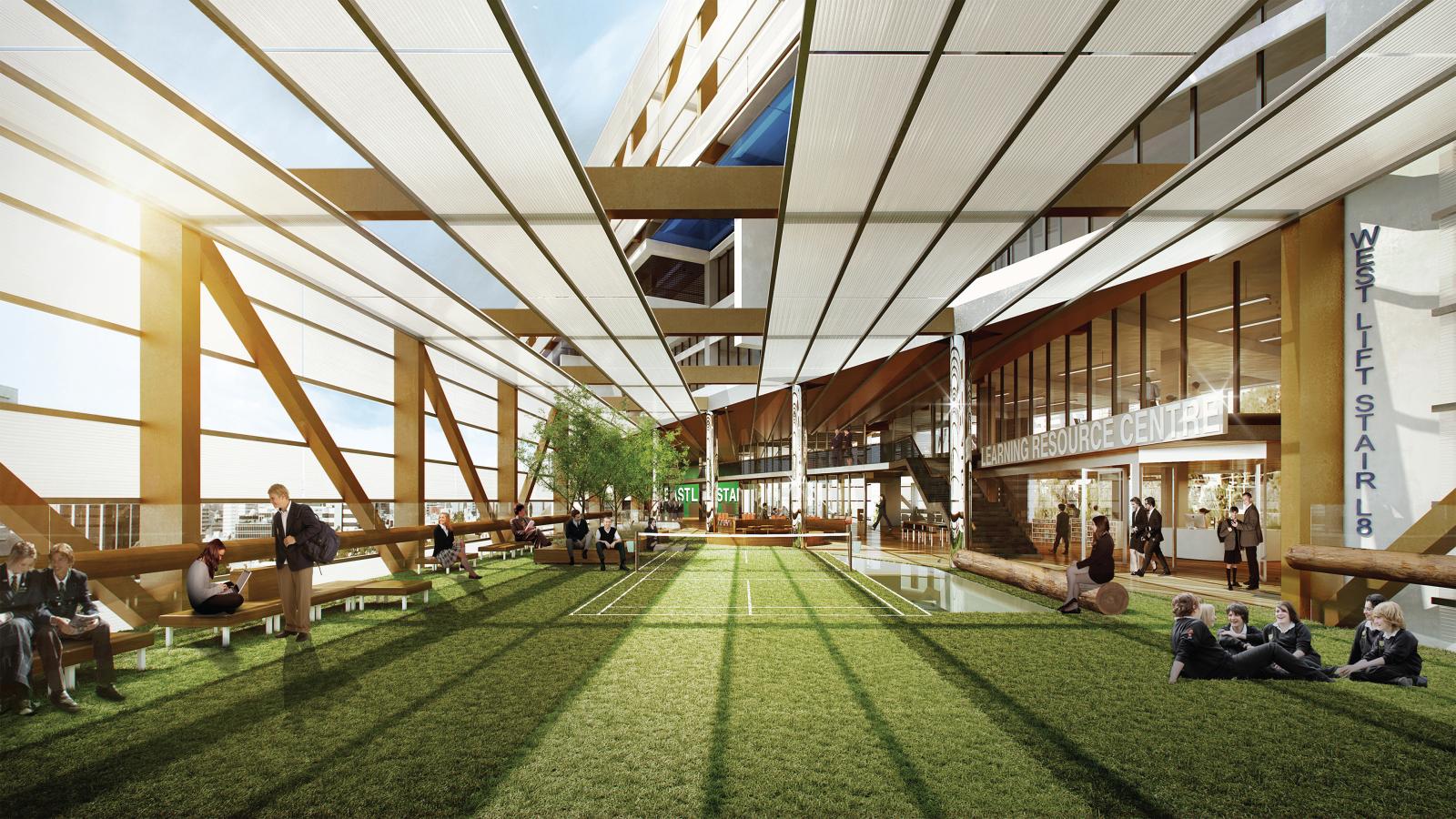 A spacious, modern indoor courtyard with a grass floor and various seating areas welcomes visitors at Arthur Phillip School in Parramatta. People engage in activities like sitting, walking, and chatting. Large slanted beams and a canopy provide shade, while glass exterior walls highlight the nearby lifts and resource center.