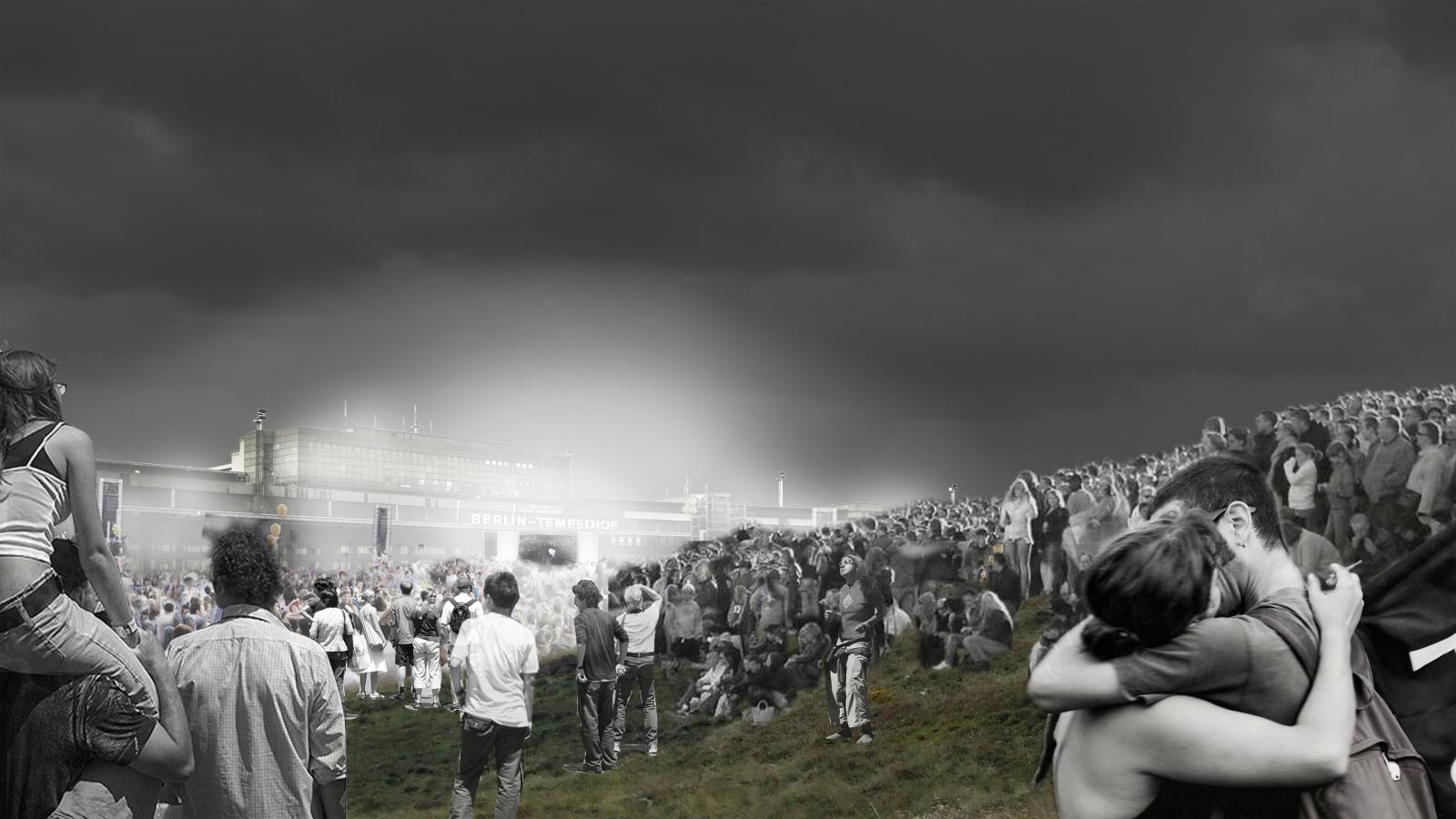 A black-and-white image depicts a large crowd of people gathered in an open field near Berlin Tempelhof Airport under a dark, cloudy sky. In the foreground, a couple embraces, while others in the background appear to be watching a concert or event.