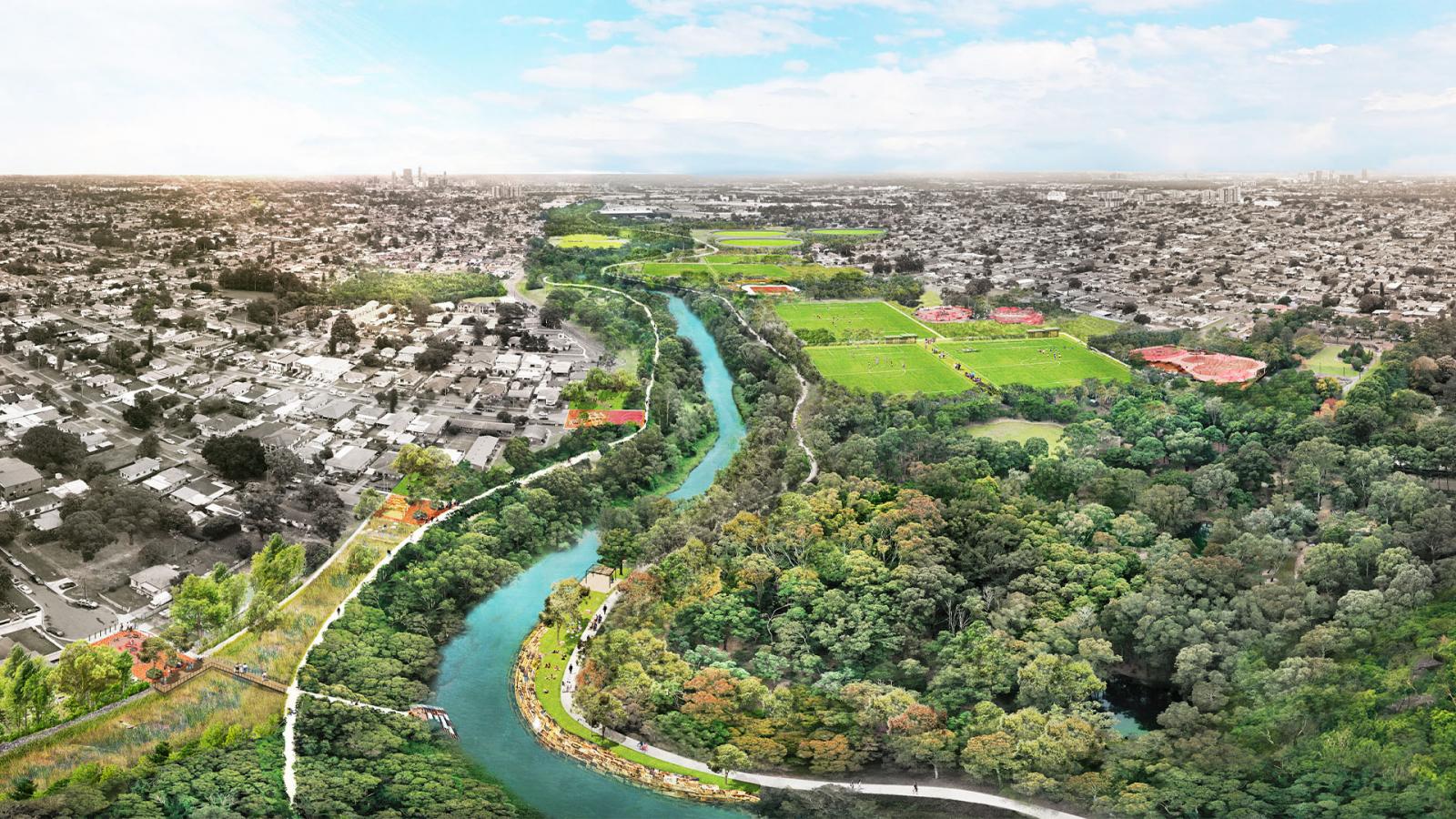 A vibrant aerial view of a city landscape with the Duck River winding through the middle. The left side displays urban buildings and homes, while the right side features lush greenery, parks, and sports fields. This masterplan highlights harmony between urban development and natural beauty under a partly cloudy sky.