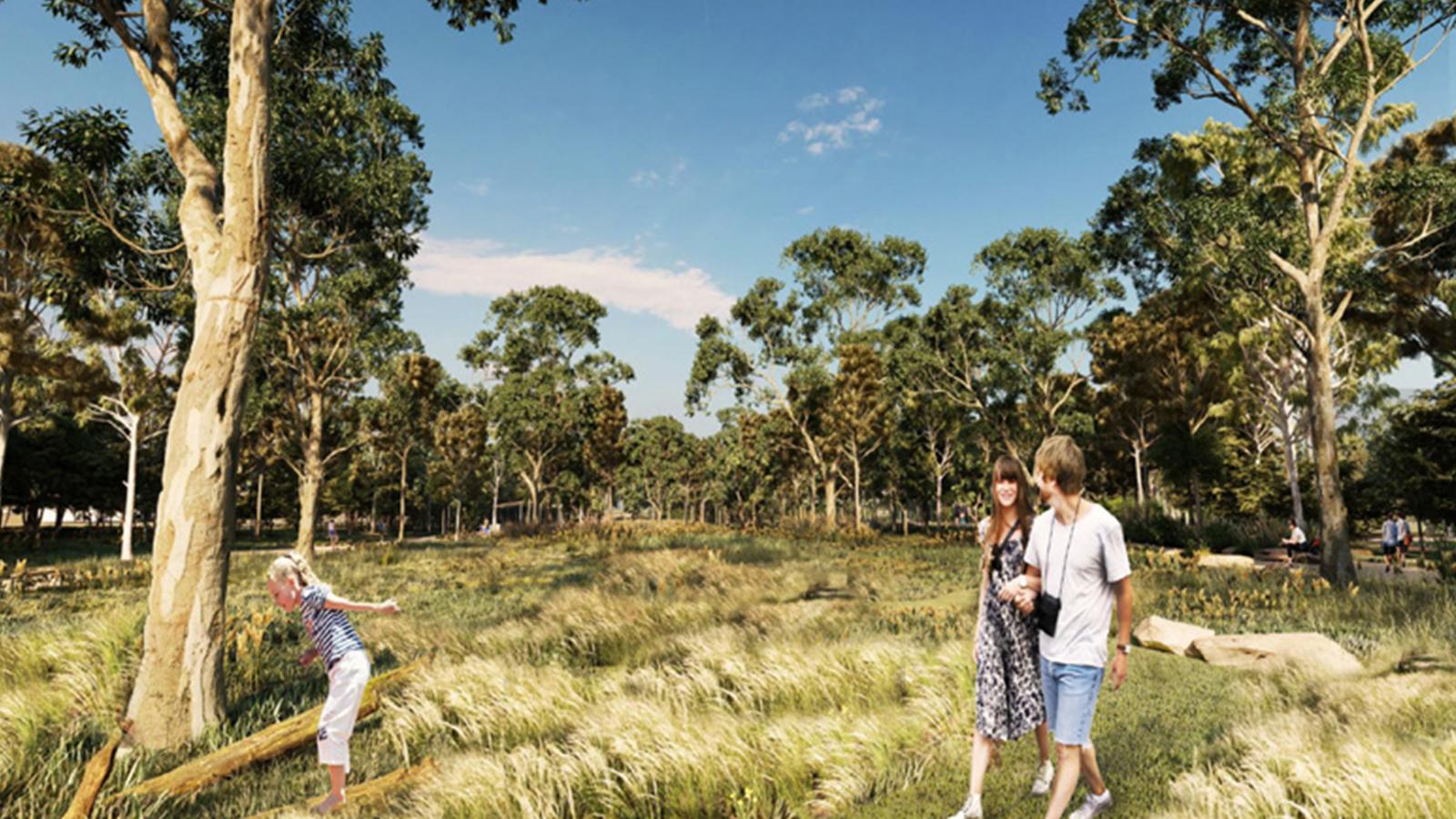 A sunlit park features mature trees and tall grass. In the foreground, a couple walks arm-in-arm along a path, while a child in the background joyfully balances on a fallen tree. The sky is clear with a few light clouds, embodying the serene beauty of Elsternwick Park Nature Reserve.