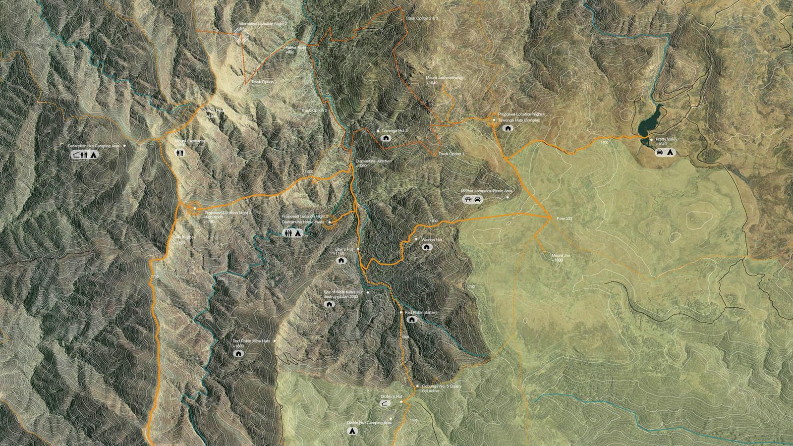 A detailed topographic map of a mountainous region showing various trails, campgrounds, and points of interest. The terrain has varying elevations, with marked paths like the Alpine Crossing and icons indicating facilities such as picnic areas, viewpoints, and water sources.