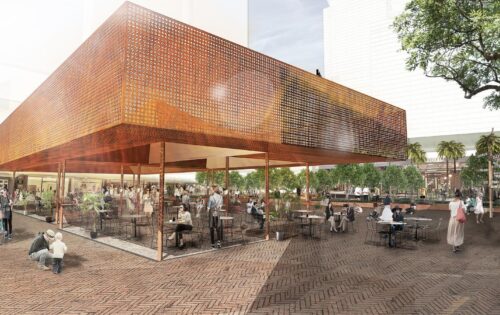 An outdoor plaza with a modern, elevated structure covered in perforated metal. People are seated at tables, walking, and socializing. Surrounding the plaza are trees and a garden area, creating a lively and inviting atmosphere that once was home to the Former Cumberland News site.