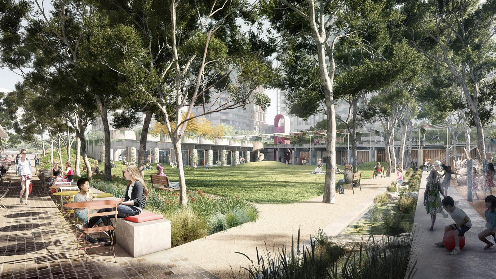 A lively park features people enjoying outdoor activities. Some sit at tables near the walkway, while others relax on benches. Children play in the green space and on a playground. Trees provide shade, and buildings are visible in the background of Central Park.