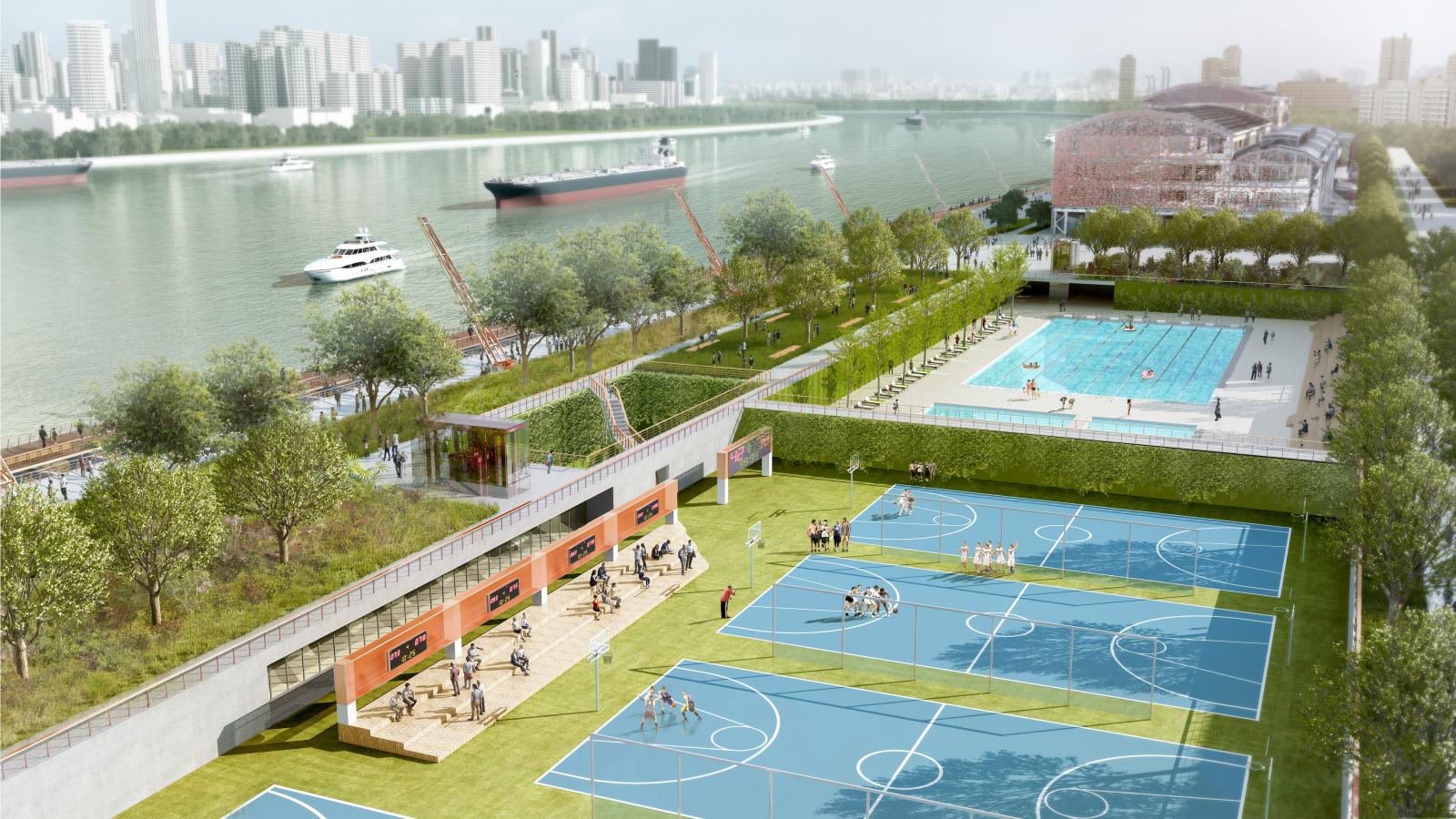 Wide-angle view of Lujiazui Waterfront Park featuring blue basketball courts, a green park area, an outdoor swimming pool, and a building. Boats and the city skyline are visible in the background, along with trees and walking paths along the riverbank.