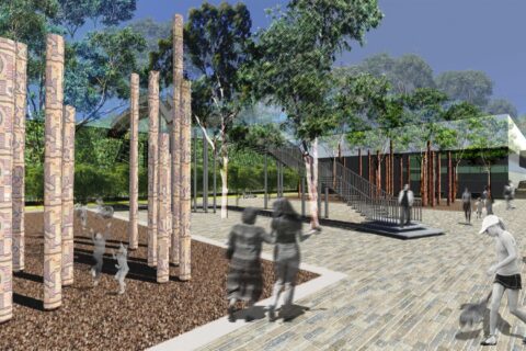 Digital rendering of an outdoor urban space in Mildura featuring tall, patterned columns and surrounded by trees. Pedestrians, including a person with a bike and someone with a dog, are depicted along paved walkways. A glass building, stairs, and seating areas near the riverfront are visible in the background.