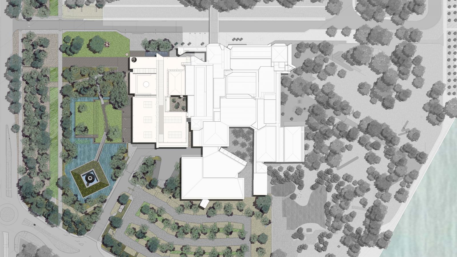 A detailed, top-down architectural plan of a large building complex with various sections and courtyards. The surrounding area includes Australian gardens, pathways, trees, and a pond with a central fountain on the left side. The bottom right corner shows a water body near the NGA section.