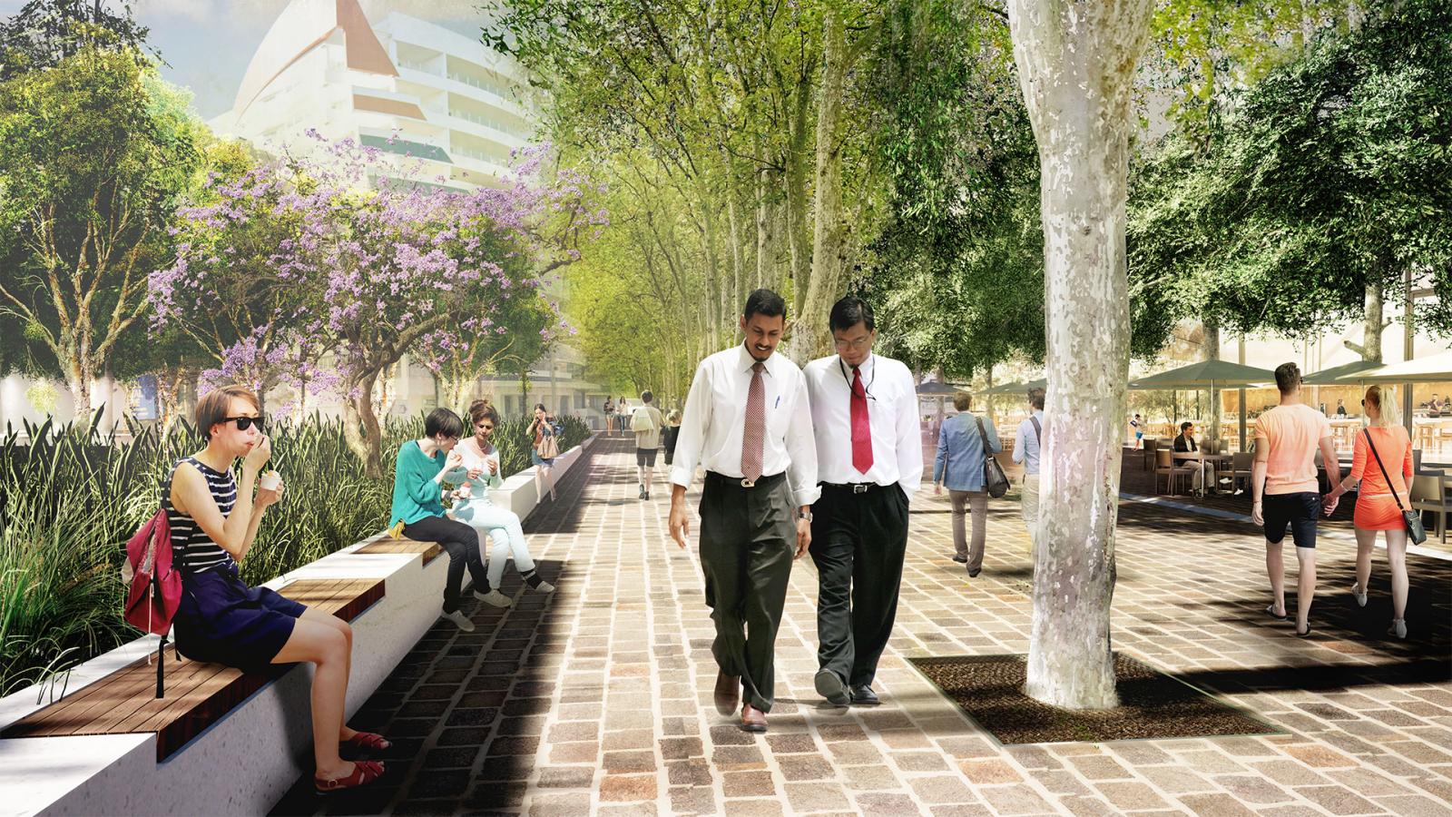 A vibrant public plaza under dappled sunlight, featuring people engaged in different activities. Two men in white shirts and ties walk together, while others sit or stroll. Trees and greenery adorn Paul Keating Park, with a small cafe on the right and modern buildings in the background.