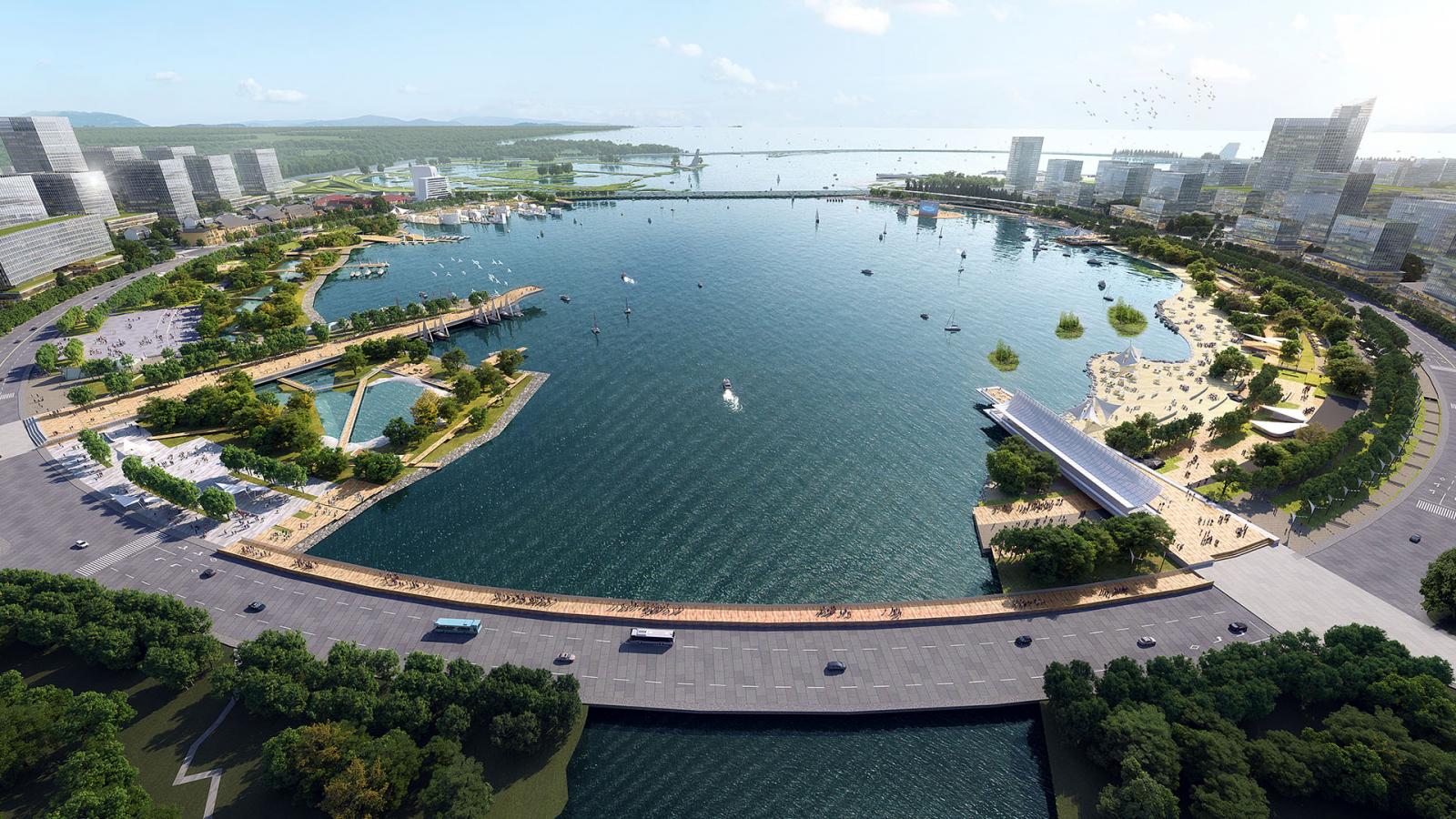 An aerial view of a large, modern cityscape reminiscent of Qingdao features a wide, circular bay surrounded by tall buildings. The bay area includes greenery, waterfront promenades, a beach, and various pontoons. A bridge spans across the calm water, with trees lining the roads near Ruyi Lake.