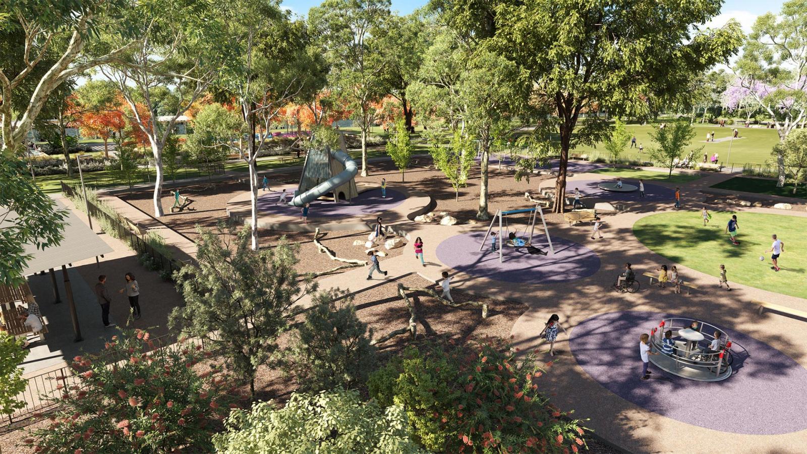 A bustling playground scene in Regatta Park with children playing on swings, a slide, and a merry-go-round. Numerous trees provide shade, and nearby is a pathway with people walking. The backdrop features green lawns and more trees under a clear sky in the heart of the Park Precinct.