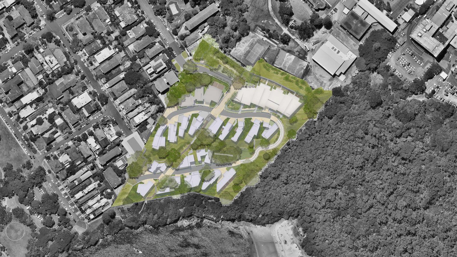 Aerial view of Spring Cove, a residential area with a planned development highlighted in the center. The development includes multiple buildings surrounded by green spaces with a main road looping through. Dense forest borders the area to the bottom and right, providing a scenic backdrop reminiscent of Manly.