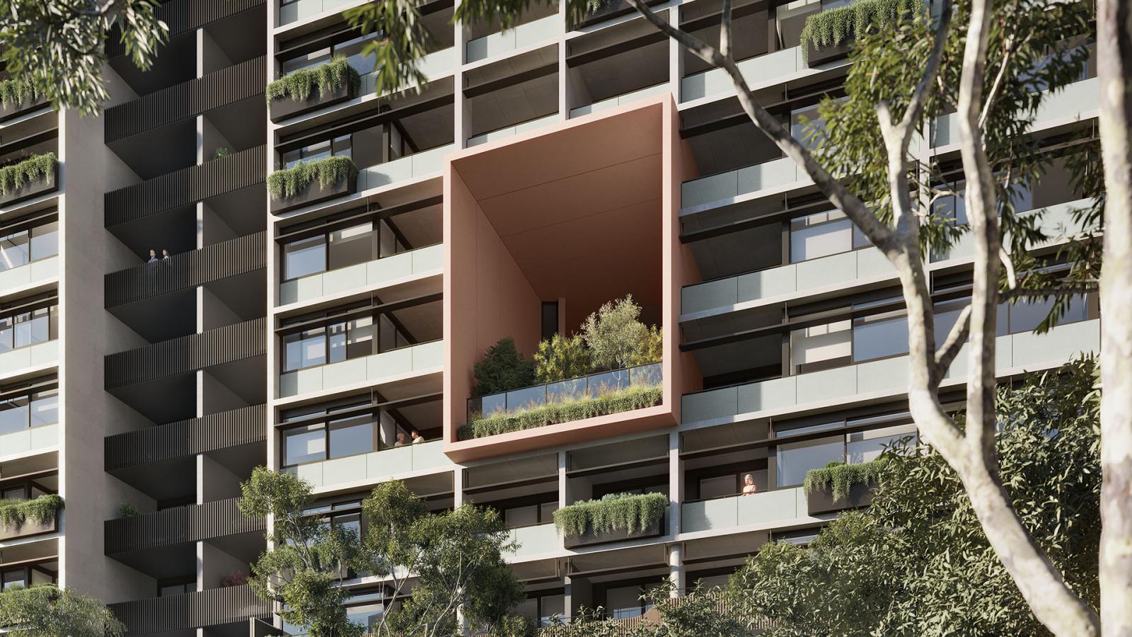 A modern multi-story apartment building at Ivanhoe Estate features a unique square-shaped, recessed balcony with greenery and small trees, giving it a treehouse feel. The facade includes various other balconies with planters. Trees in the foreground further enhance the building's green aesthetic.