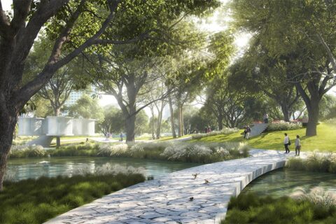 A serene park scene with a stone pathway crossing over a pond. Lush green trees provide shade, and people can be seen walking and sitting on the grass. Sunlight filters through the leaves creating a peaceful ambiance. A modern structure in the style of Wuxi's Taihu Plaza is visible in the background.