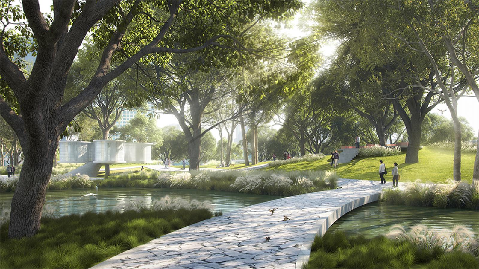 A serene park scene with a stone pathway crossing over a pond. Lush green trees provide shade, and people can be seen walking and sitting on the grass. Sunlight filters through the leaves creating a peaceful ambiance. A modern structure in the style of Wuxi's Taihu Plaza is visible in the background.