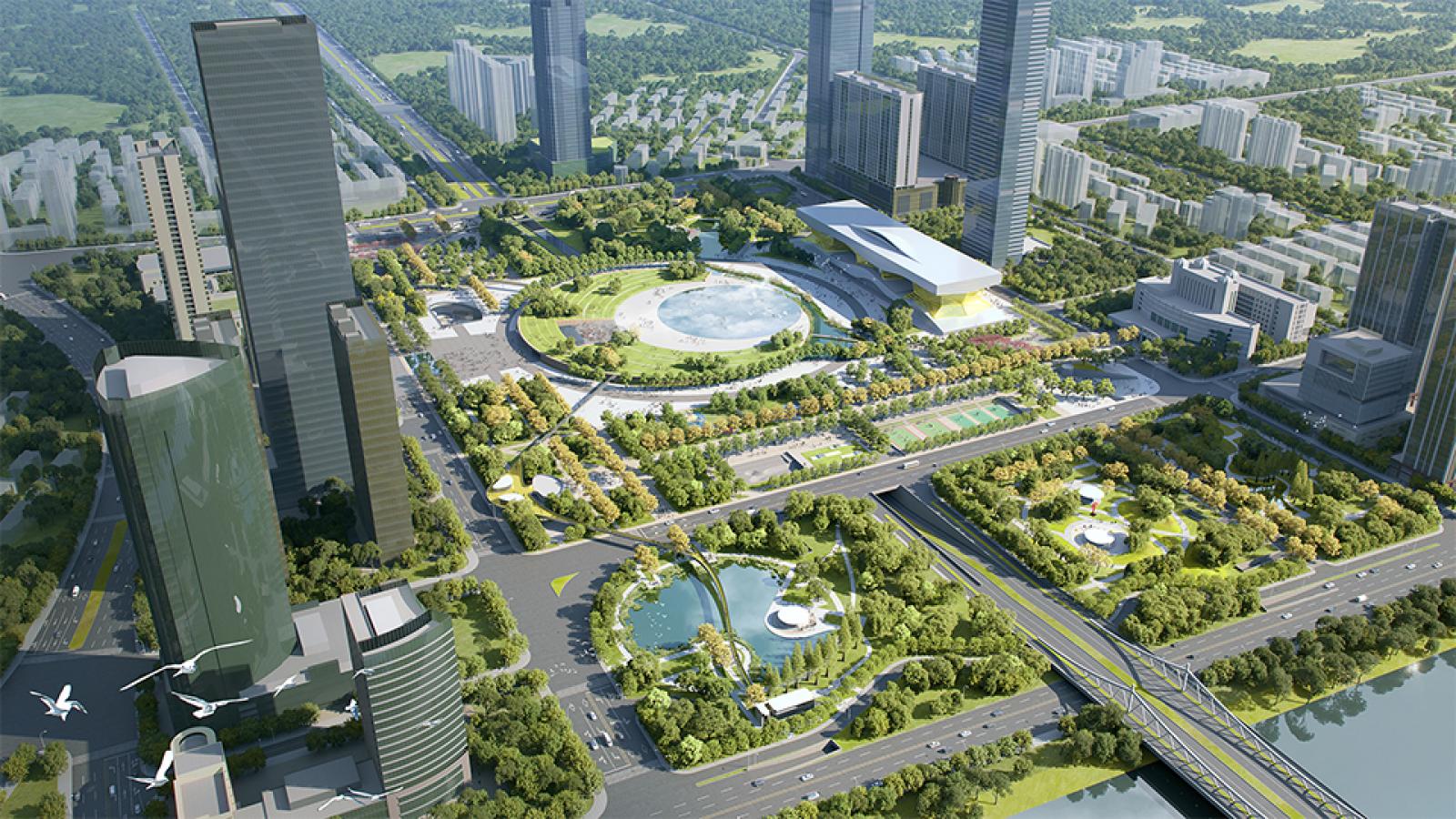 Aerial view of Wuxi's urban area featuring tall skyscrapers, lush green parks, and the iconic Taihu Plaza at the center. The layout includes tree-lined roads, recreational facilities, and water bodies. Buildings and residential areas surround this central park space.