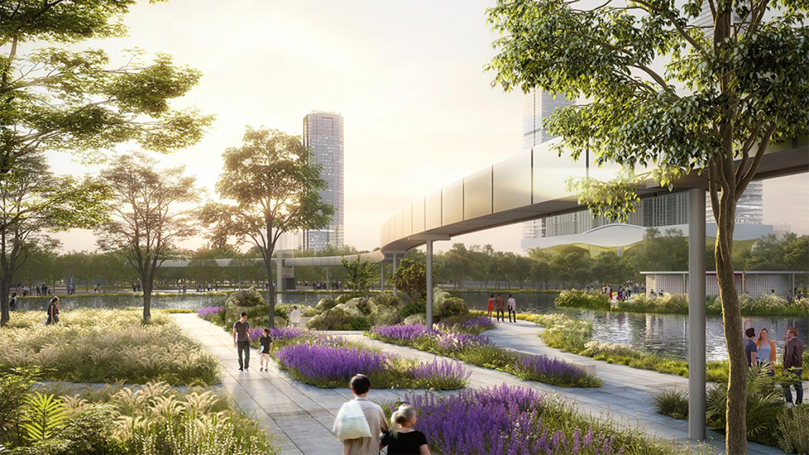 A serene urban park scene in Wuxi with people walking along pathways surrounded by lush greenery and vibrant purple flowers. Tall city buildings are visible in the background, and a modern, elevated walkway curves above the plaza. The sky is clear with a warm sunset over Taihu.