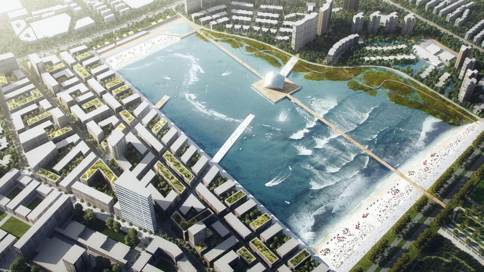 Aerial view of Xiangmihu Park in the city, featuring a large, rectangular artificial water body with waves, surrounded by modern buildings, green spaces, and sandy beach areas. Pedestrian pathways and a bridge cross the water. People engage in various activities around the water.