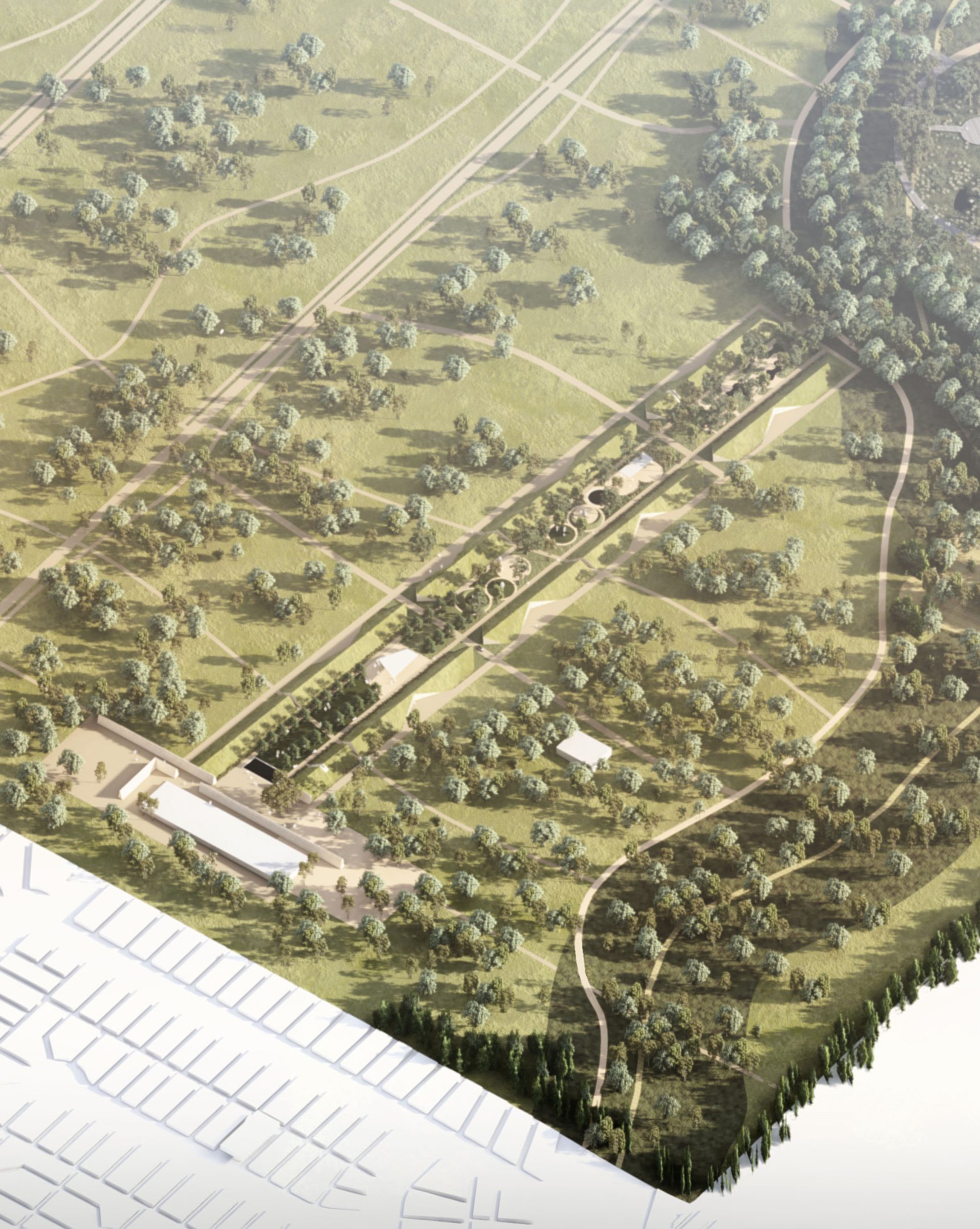 Aerial view of a vast park with a rectangular, tree-lined promenade at the center, surrounded by green fields and clusters of trees. To the right is a winding path through wooded areas. At the bottom left, buildings and a grid-like pattern of streets reveal an intricate masterplan.