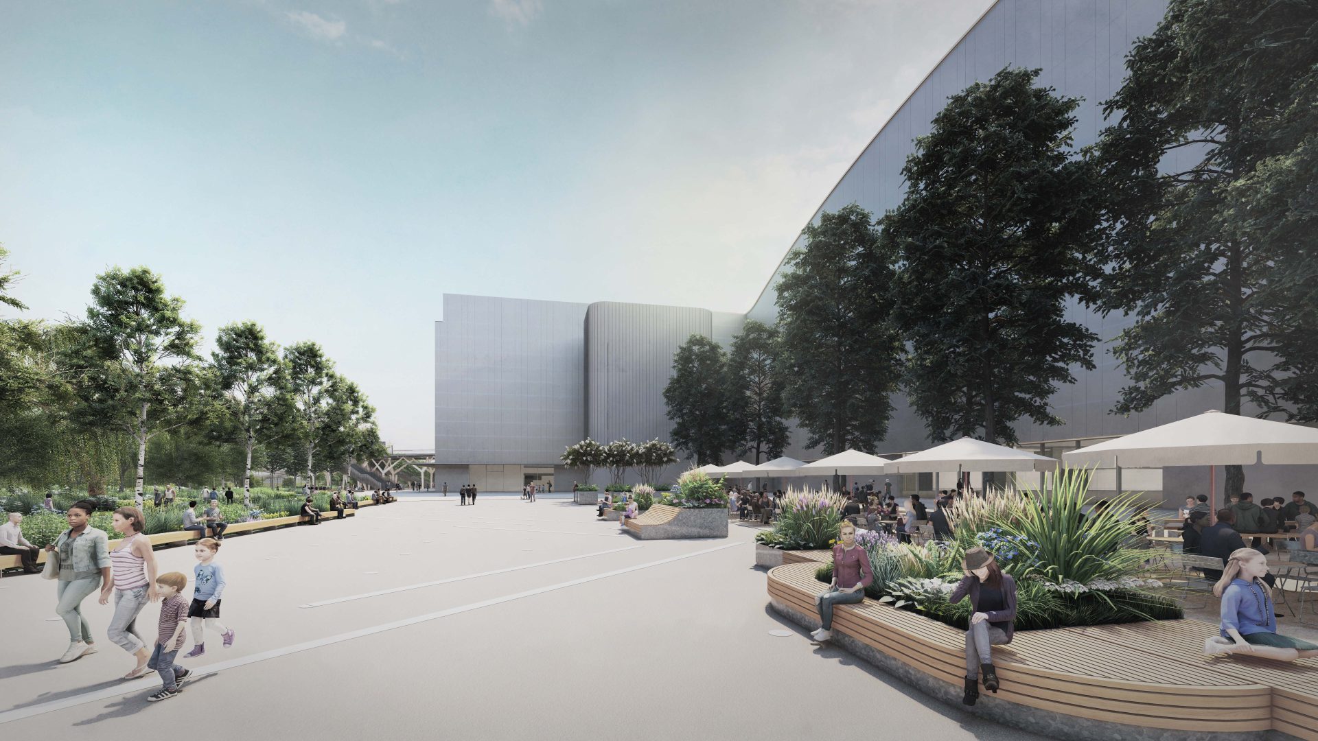 Modern public plaza with people walking and sitting on curved benches surrounded by greenery near YTL Arena. Outdoor seating under umbrellas to the right. Large, contemporary buildings and tall trees line the background. The atmosphere is bright and inviting.