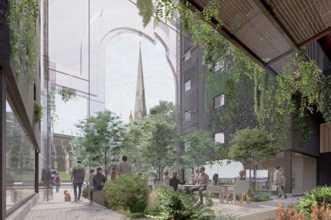 A courtyard with people sitting and walking, surrounded by modern buildings and lush greenery on Portwall Lane. The space includes trees, plants, and benches. In the background, there is a large archway and the spire of a traditional church building in Redcliffe is visible.