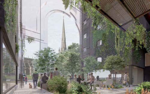 A courtyard with people sitting and walking, surrounded by modern buildings and lush greenery on Portwall Lane. The space includes trees, plants, and benches. In the background, there is a large archway and the spire of a traditional church building in Redcliffe is visible.