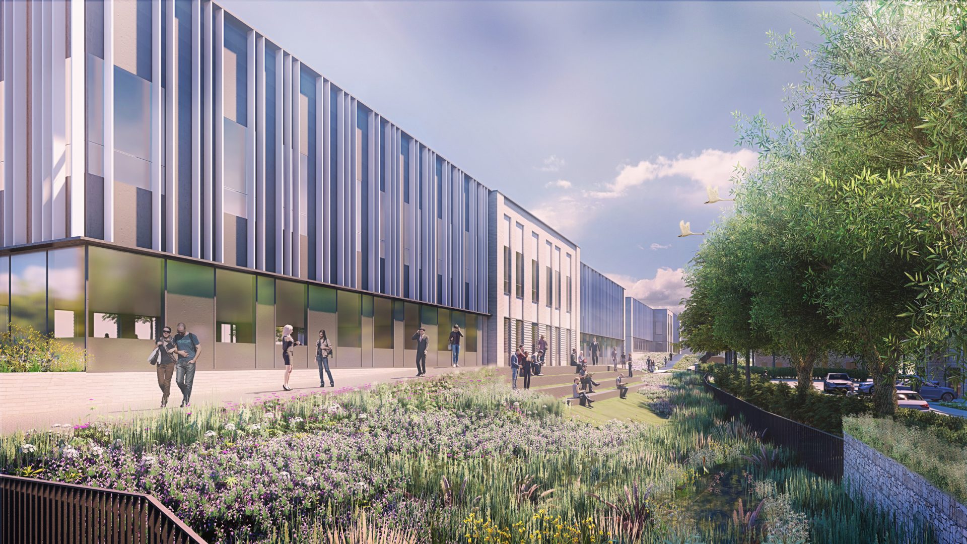 A modern, multi-story building with a sleek design featuring large windows and vertical metal panels graces the heart of Oxford. People walk along a landscaped pathway filled with greenery, flowers, and trees under a partly cloudy sky. Cars are parked on the right side, completing this scene of innovation.