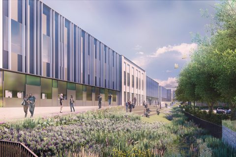 A modern, multi-story building with a sleek design featuring large windows and vertical metal panels graces the heart of Oxford. People walk along a landscaped pathway filled with greenery, flowers, and trees under a partly cloudy sky. Cars are parked on the right side, completing this scene of innovation.