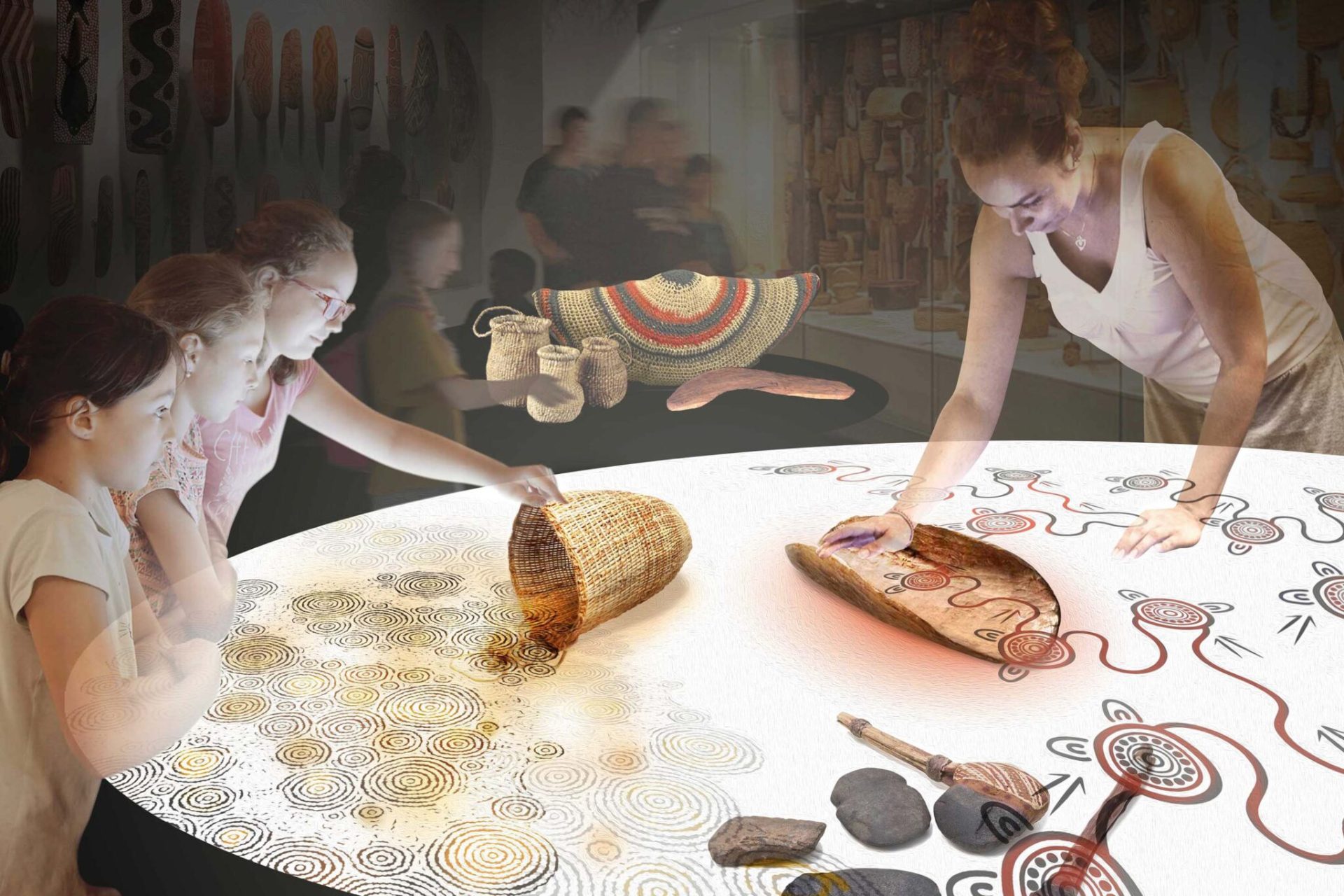 Children and an adult are engaged in an interactive exhibit within the Cultural Precinct, featuring Aboriginal art and traditional artifacts, including baskets, tools, and decorated wooden pieces. The display is illuminated, highlighting patterns and symbols on the table that tell stories of Ngurra.