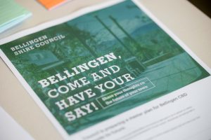 A flyer from the Bellingen Shire Council reads, "BELLINGEN, COME AND HAVE YOUR SAY! Share your thoughts on the future of your town." The flyer, showcasing an outdoor scene with trees, invites community involvement in shaping Sustainable Master Plans for Bellingen and Dorrigo.