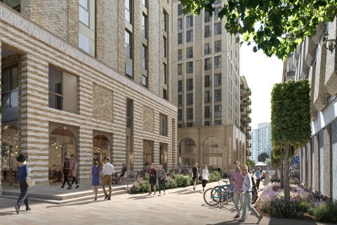 A modern city street, Clarence Road, lined with tall buildings featuring large windows and outdoor seating. People are walking along the sidewalk, some holding hands, others talking. Bicycles are parked near planters with flowers and greenery. Trees provide shade.